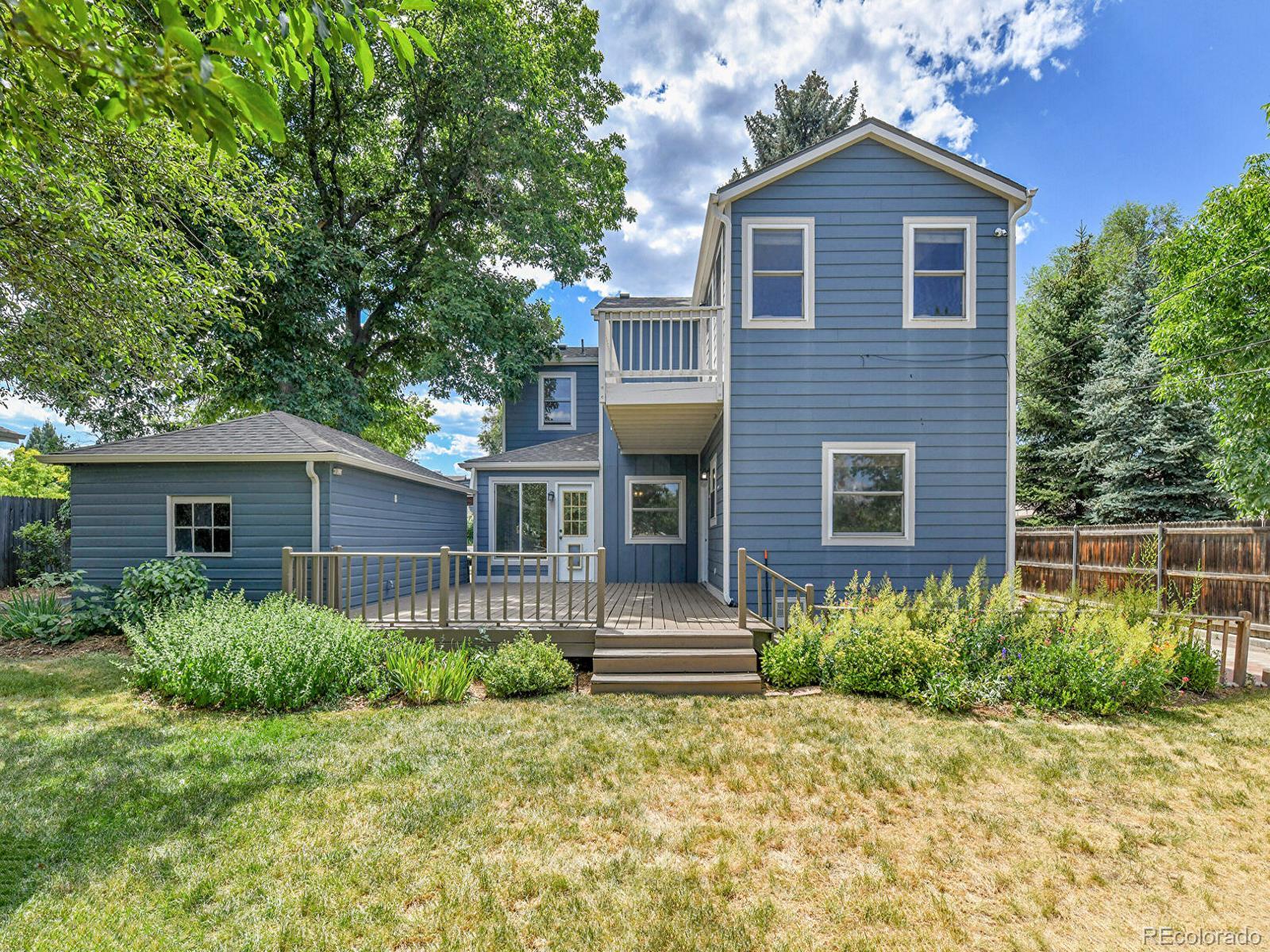 3282 Depew Street Wheat Ridge, CO 80212 - Photo 42 of 50 a front view of a house with a yard
