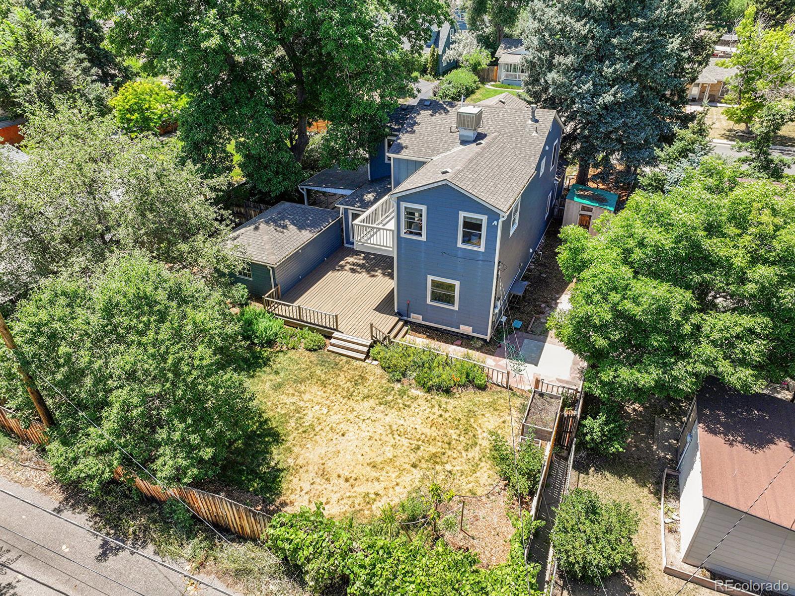 3282 Depew Street Wheat Ridge, CO 80212 - Photo 45 of 50 an aerial view of a house with a yard and large tree