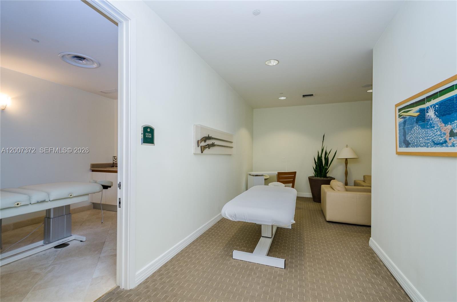 1643 Brickell Avenue, Unit 1103 Miami, FL 33129 - Photo 28 of 32 a living room with furniture and a painting on the wall