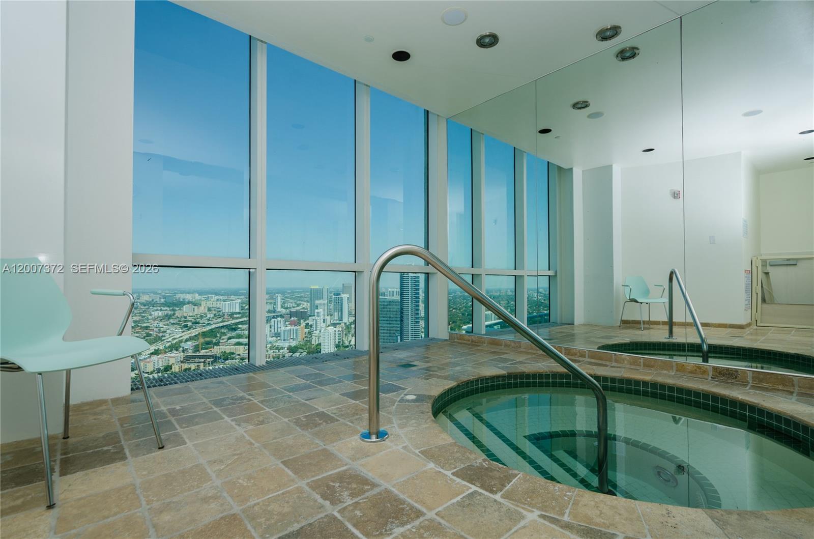 1643 Brickell Avenue, Unit 1103 Miami, FL 33129 - Photo 31 of 32 a bathroom with a sink and a mirror