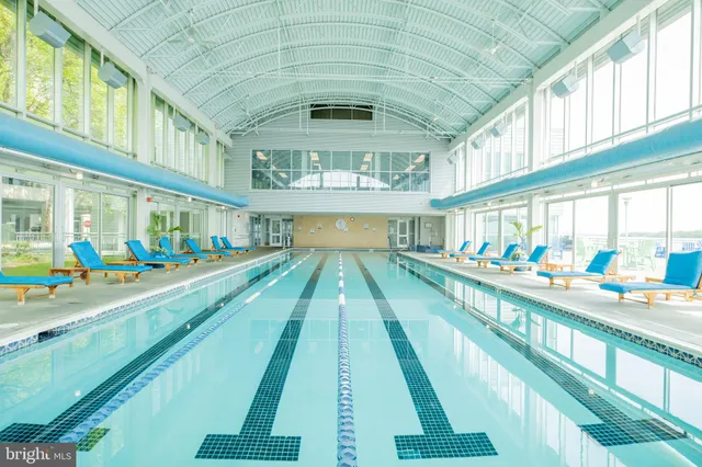 a view of swimming pool with outdoor seating