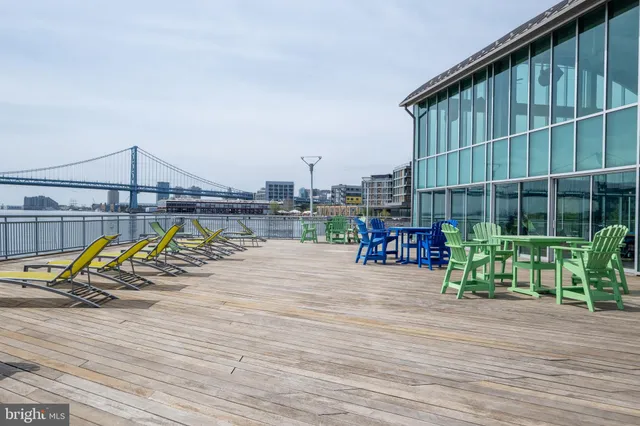 a view of a balcony with furniture and stove