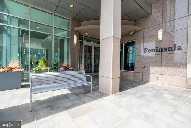 a view of a bathroom with a glass door shower and sink