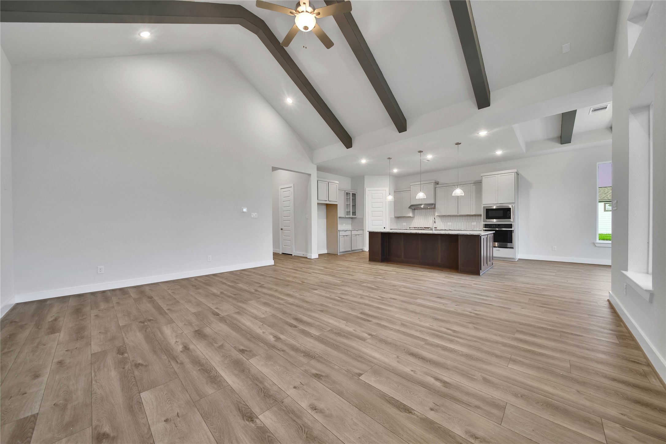 4602 Magnolia Bend Drive Rosharon, TX 77583 - Photo 5 of 39 a view of kitchen and hall with wooden floor
