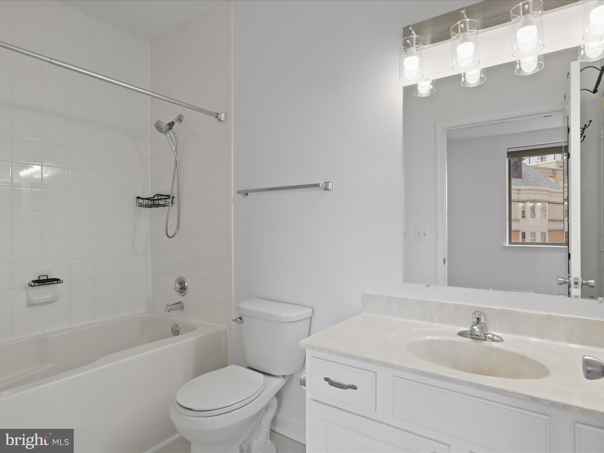 3830 9th Street North, Unit PH3E Arlington, VA 22203 - Photo 33 of 44 a bathroom with a sink a toilet and shower