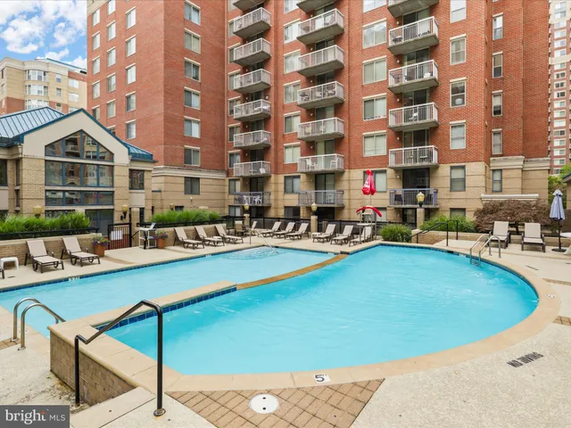 a view of a swimming pool with a lounge chairs