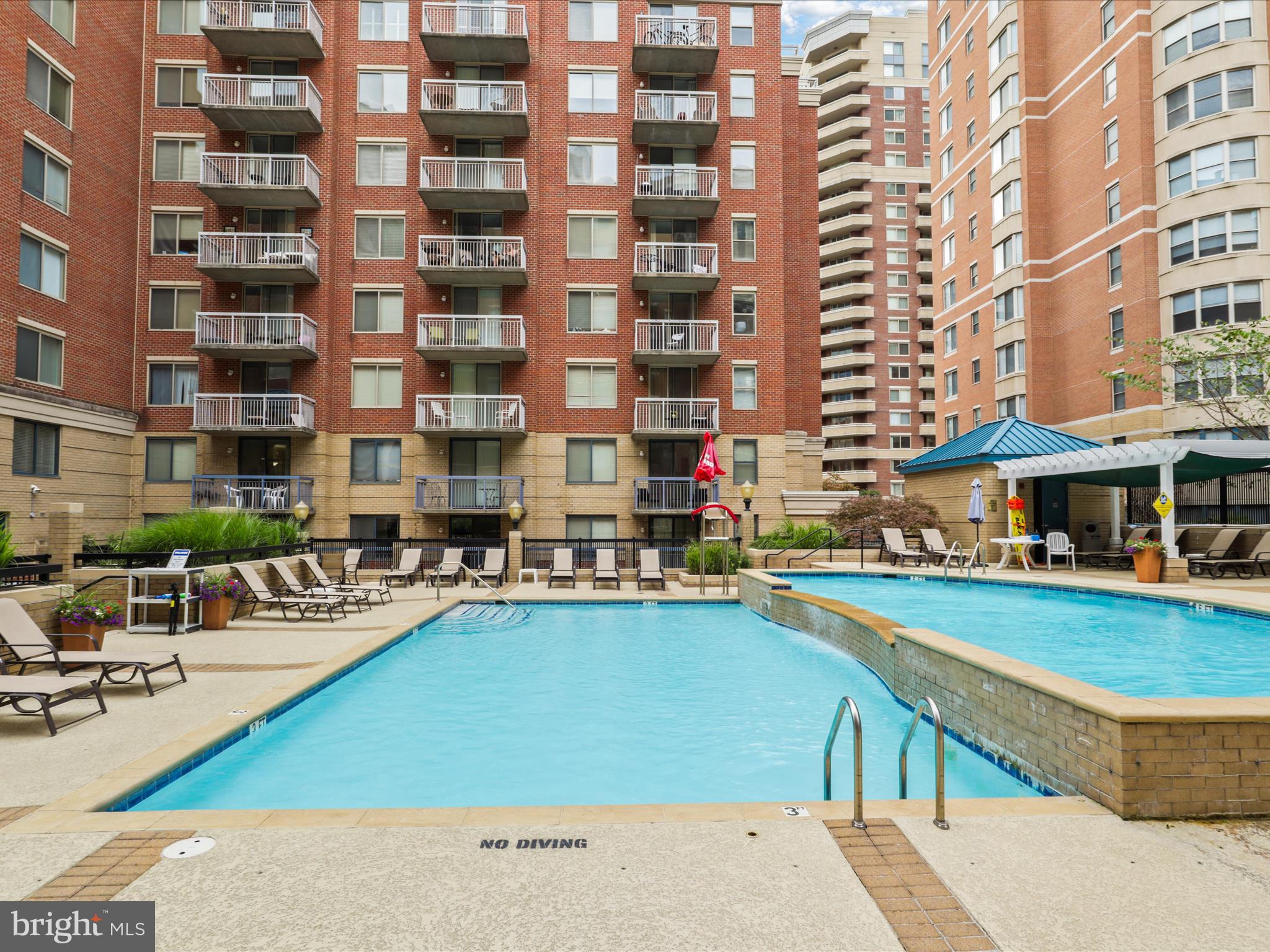3830 9th Street North, Unit PH3E Arlington, VA 22203 - Photo 38 of 44 a view of a swimming pool with outdoor seating