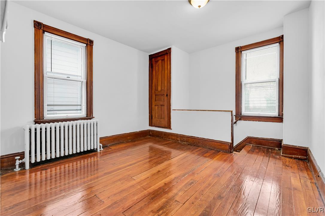 911 Spring Garden Street Easton, PA 18042 - Photo 18 of 48 a view of empty room with wooden floor and fan