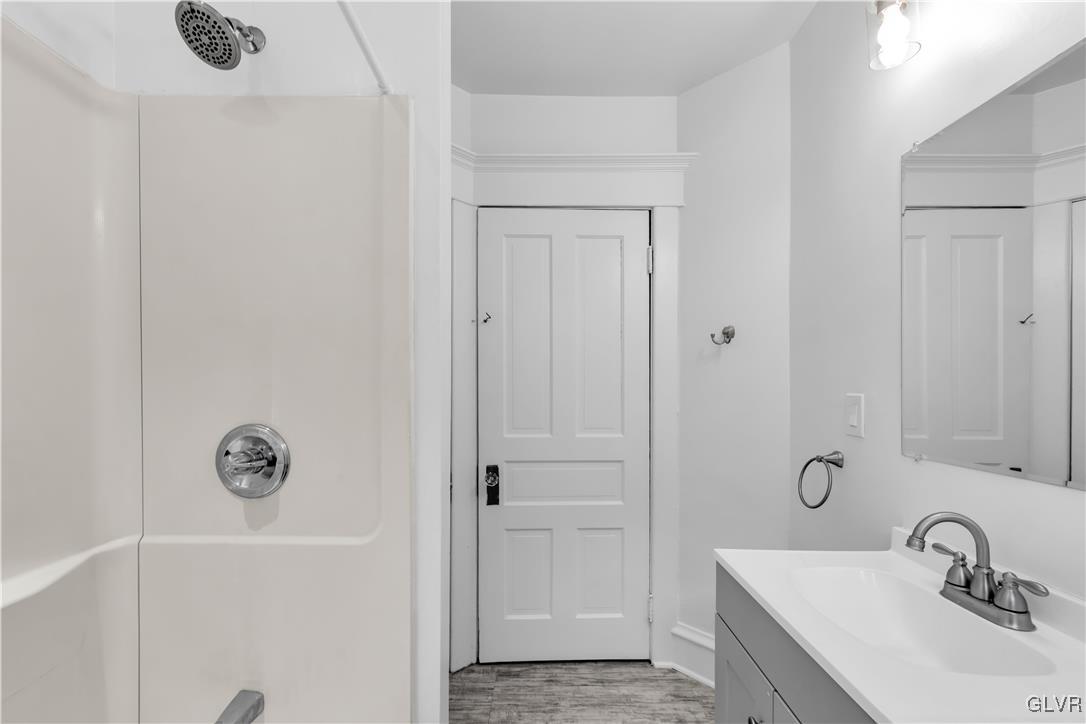 911 Spring Garden Street Easton, PA 18042 - Photo 20 of 48 a bathroom with a sink a toilet and shower