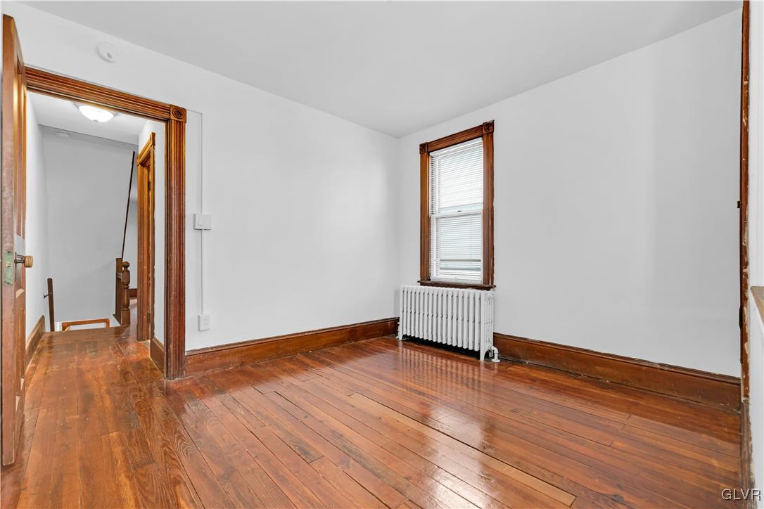 911 Spring Garden Street Easton, PA 18042 - Photo 22 of 48 a view of empty room with wooden floor and fan