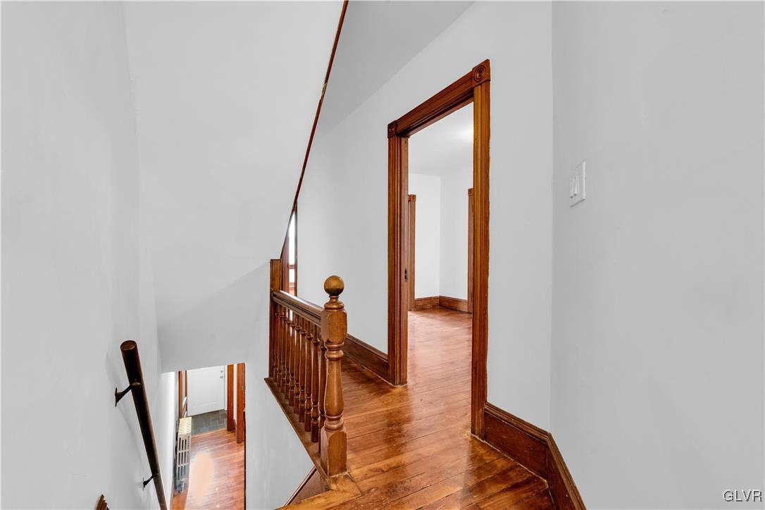 911 Spring Garden Street Easton, PA 18042 - Photo 25 of 48 a view of hallway with furniture and wooden floor