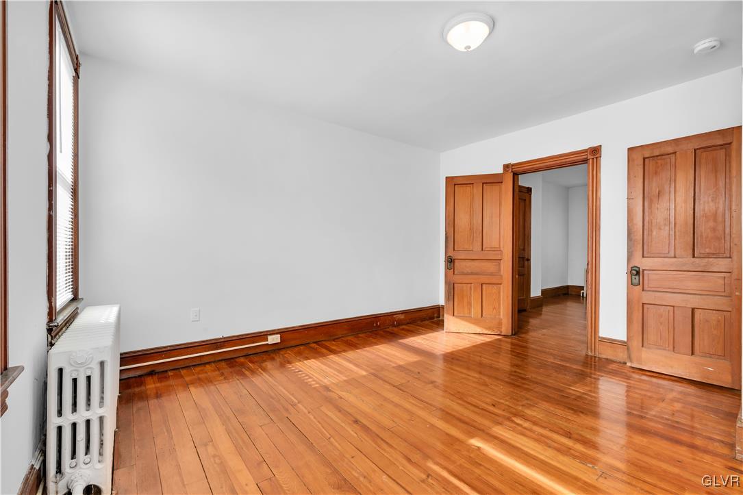 911 Spring Garden Street Easton, PA 18042 - Photo 26 of 48 a view of an empty room with wooden floor