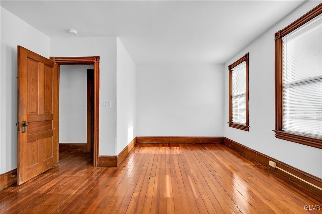 911 Spring Garden Street Easton, PA 18042 - Photo 27 of 48 a view of empty room with wooden floor and fan