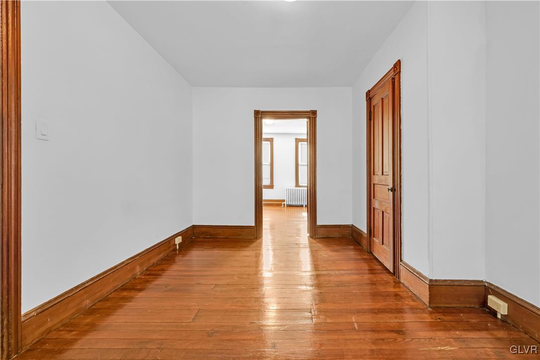 911 Spring Garden Street Easton, PA 18042 - Photo 29 of 48 a view of an empty room and wooden floor