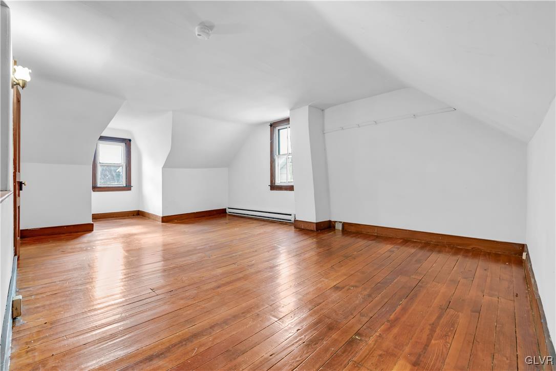 911 Spring Garden Street Easton, PA 18042 - Photo 30 of 48 an empty room with wooden floor and windows