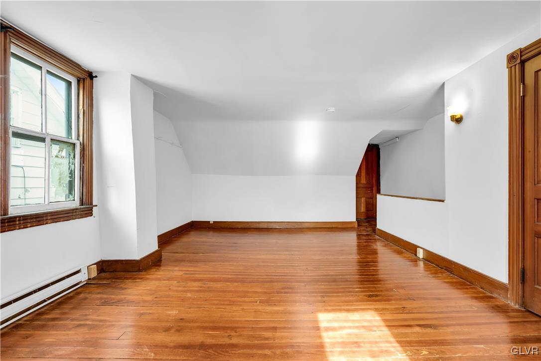 911 Spring Garden Street Easton, PA 18042 - Photo 31 of 48 a view of an empty room with wooden floor and a window