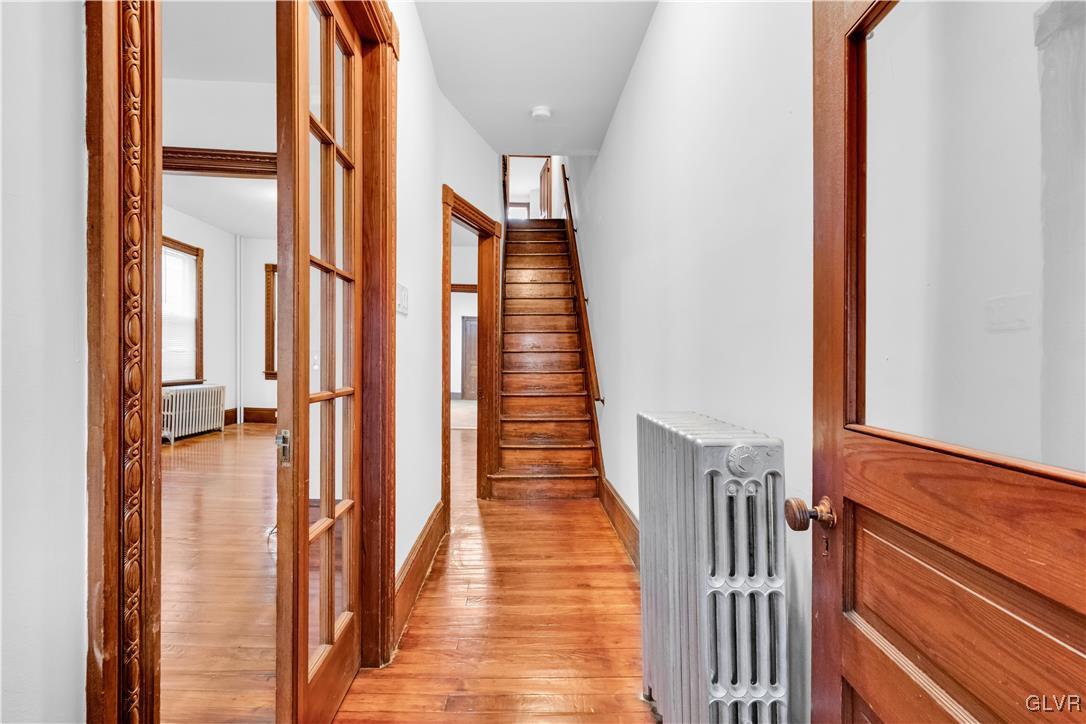 911 Spring Garden Street Easton, PA 18042 - Photo 5 of 48 a view of a hallway with wooden floor and staircase