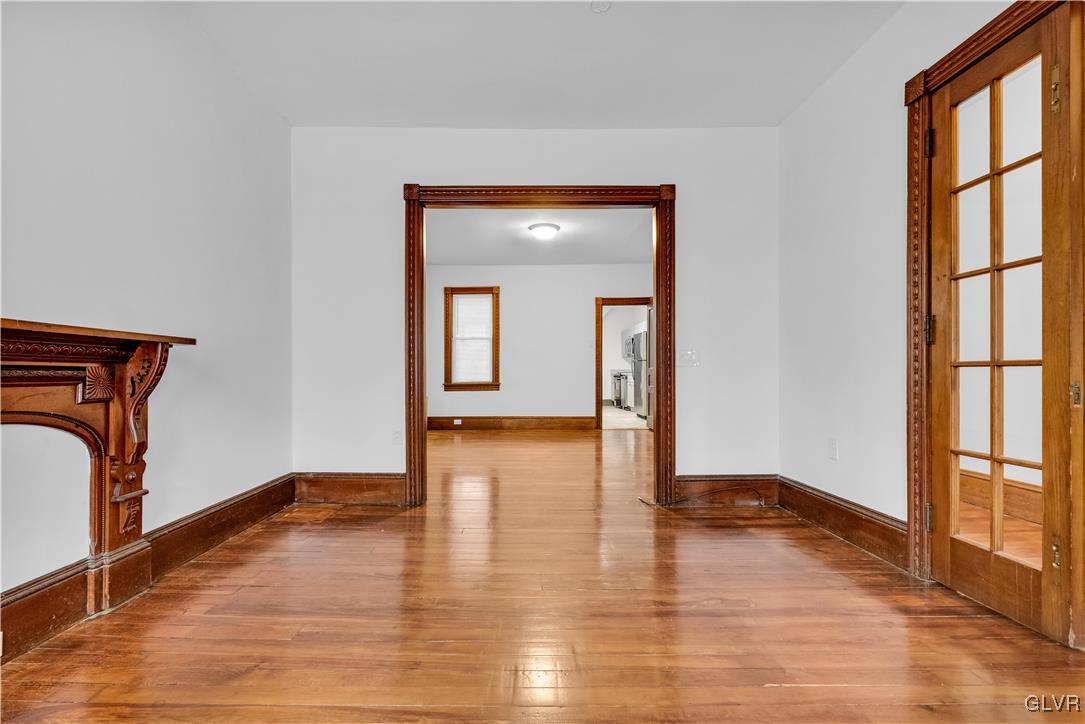 911 Spring Garden Street Easton, PA 18042 - Photo 10 of 48 a view of empty room with wooden floor and fan