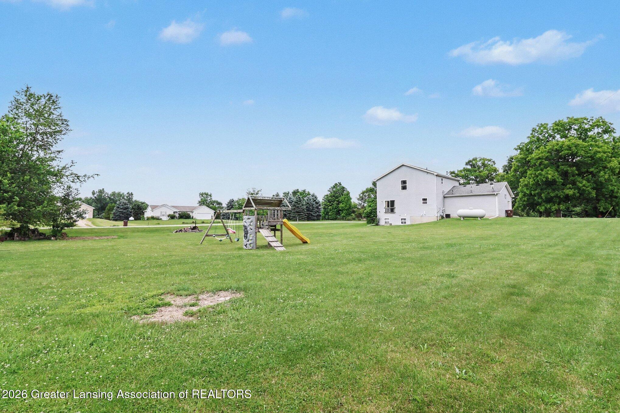 8585 North Gregory Road Fowlerville, MI 48836 - Photo 22 of 26 Backyard