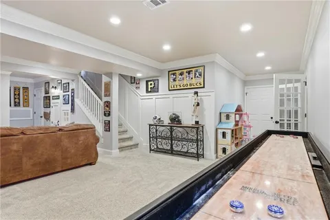 a view of a living room and entryway with wooden floor