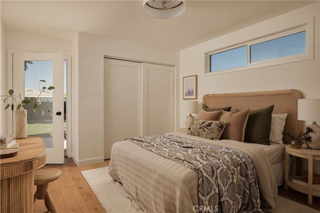 a bedroom with double bed and a window