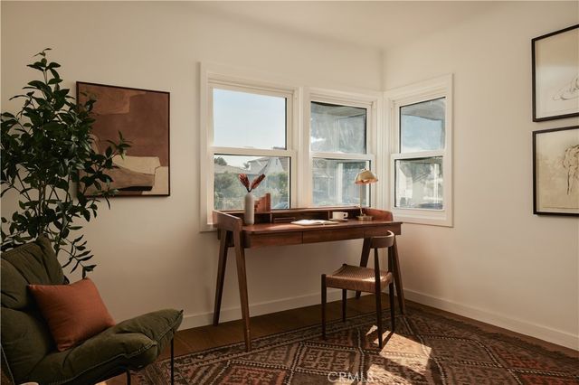 a room with furniture and a potted plant