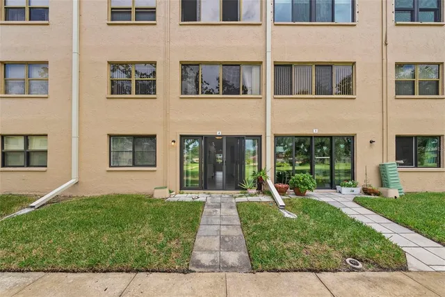 a view of a park with large trees