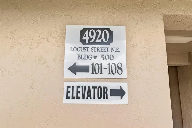 a view of a backyard with plants and swimming pool