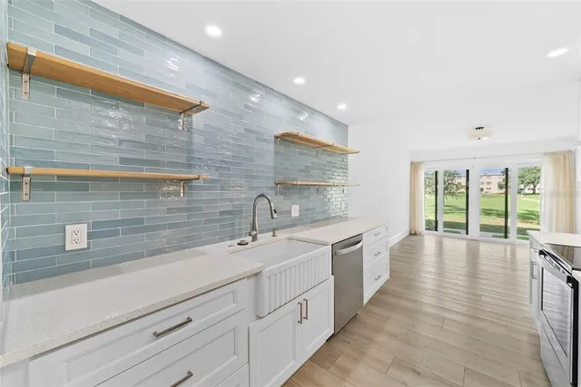 a spacious bathroom with a double vanity sink and a large mirror