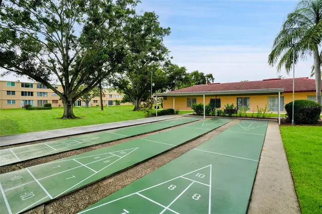 a view of a porch with furniture and a garage