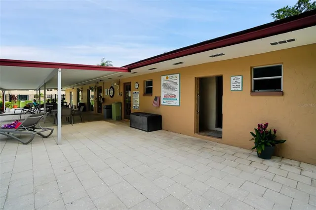 a view of a garden with flowers and trees