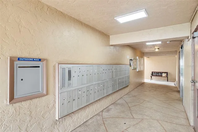 a front view of a house with a garden and parking space
