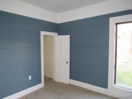 210 South 2nd Street Victor, CO 80860 - Photo 6 of 23 an empty room with windows