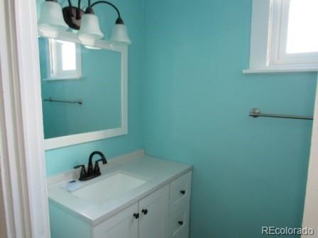 210 South 2nd Street Victor, CO 80860 - Photo 7 of 23 a bathroom with a sink and a mirror