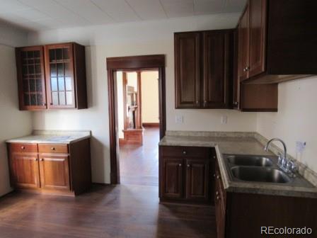 210 South 2nd Street Victor, CO 80860 - Photo 10 of 23 a kitchen with stainless steel appliances granite countertop a sink stove and cabinets
