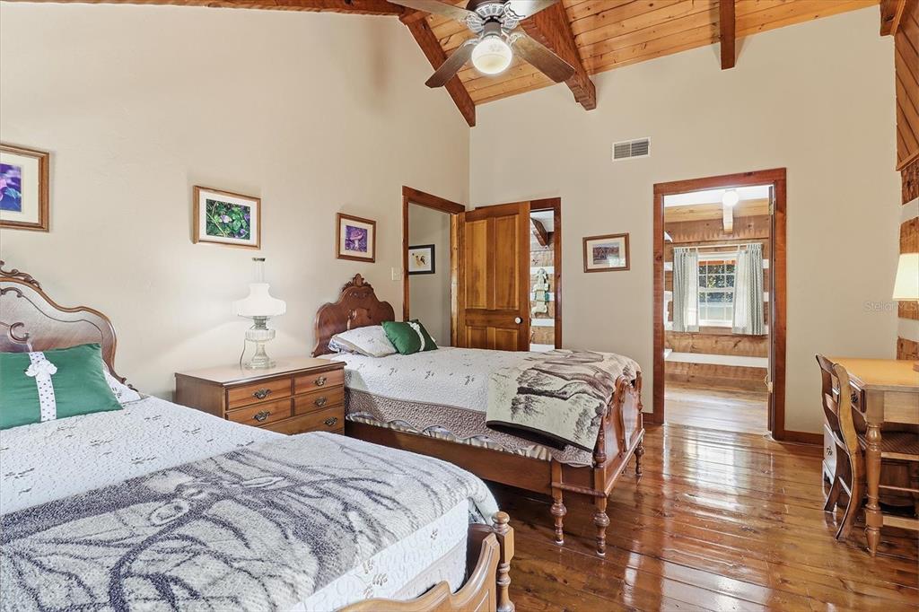 7310 South Irma Point Lecanto, FL 34461 - Photo 19 of 48 a bedroom with two beds and a table