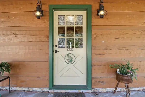 a sitting area with furniture and potted plants