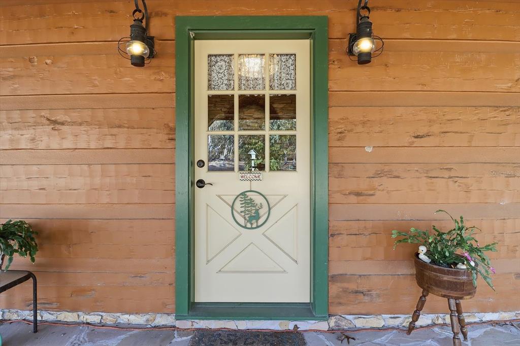 7310 South Irma Point Lecanto, FL 34461 - Photo 28 of 48 a bench sitting in front of a door