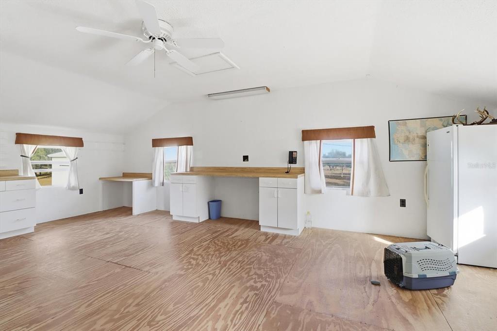 7310 South Irma Point Lecanto, FL 34461 - Photo 37 of 48 a view of a kitchen with furniture and wooden floor