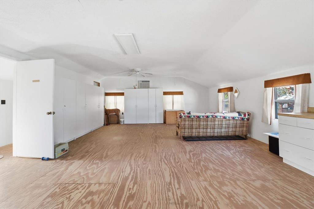 7310 South Irma Point Lecanto, FL 34461 - Photo 38 of 48 a bedroom with a bed and a large window