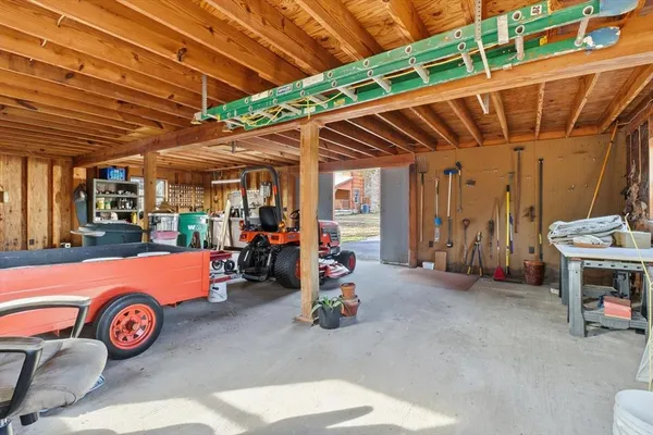 an aerial view of a house with a yard and lake view