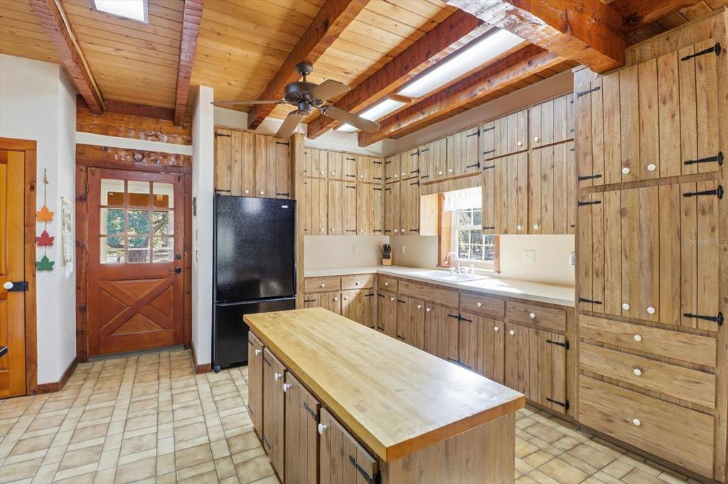 7310 South Irma Point Lecanto, FL 34461 - Photo 7 of 48 a kitchen with stainless steel appliances granite countertop a sink and cabinets