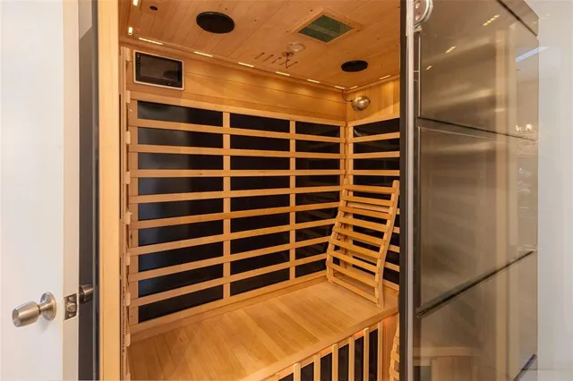 a view of walk in closet with empty racks