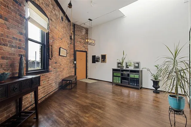 a view of a livingroom with furniture and hardwood floor