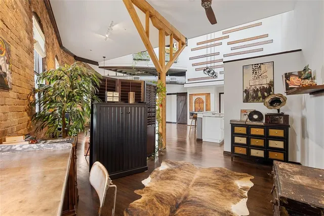 a view of a porch with a table and chairs and potted plants