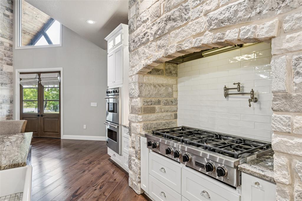 12877 Foutch Road Pilot Point, TX 76258 - Photo 15 of 40 a white stove top oven sitting inside of a kitchen