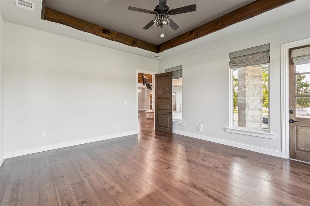 12877 Foutch Road Pilot Point, TX 76258 - Photo 20 of 40 wooden floor in an empty room with a window