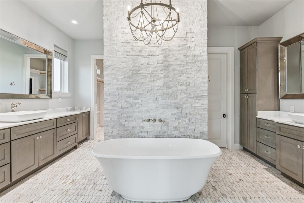 12877 Foutch Road Pilot Point, TX 76258 - Photo 21 of 40 a bathroom with a bathtub sink and mirror