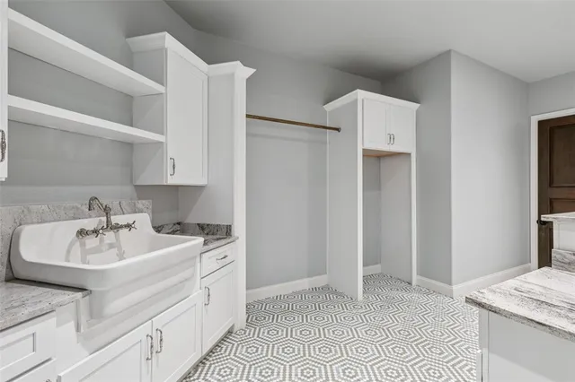 an empty room with wooden floor and a window