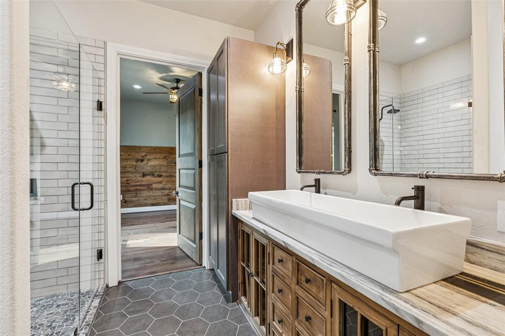 12877 Foutch Road Pilot Point, TX 76258 - Photo 29 of 40 a bathroom with a double vanity sink mirror and double